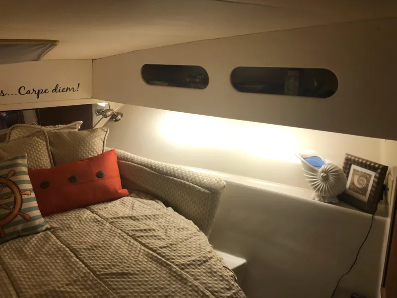 Slide: The Image of Cozy bedroom in a 1990 Bluewater Sedan with decorative pillows and soft lighting. - 27