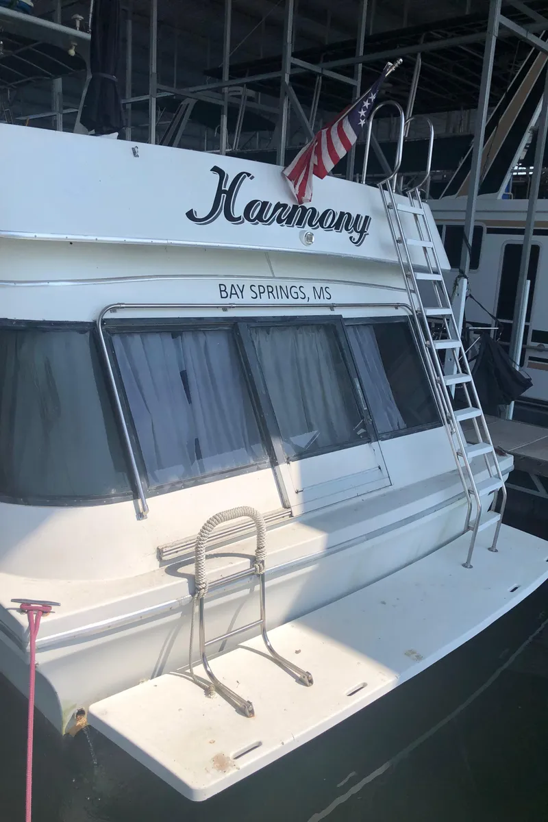 Slide: The Image of 1990 Bluewater Sedan boat named Harmony docked at Bay Springs, MS. - 6