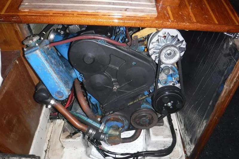 Slide: The Image of Engine compartment of a 1986 Fast Masthead Sloop with bowthruster, showcasing mechanical components. - 10