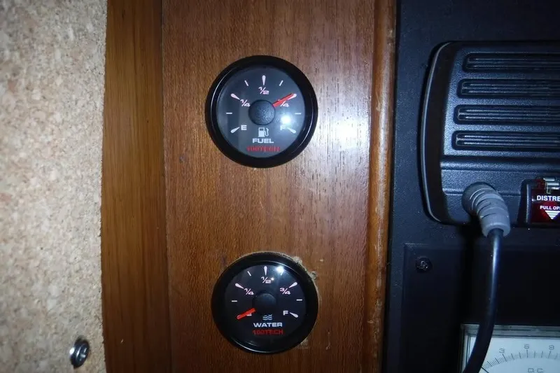 Slide: The Image of Control panel of 1986 Fast Masthead Sloop with fuel and water gauges. - 7