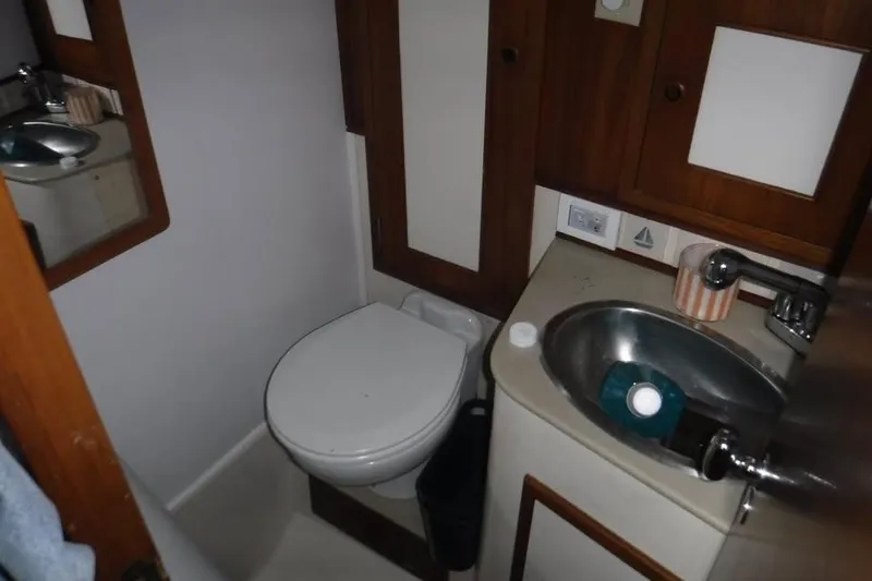 Slide: The Image of Compact bathroom in 1986 Fast Masthead Sloop with sink and toilet. - 9