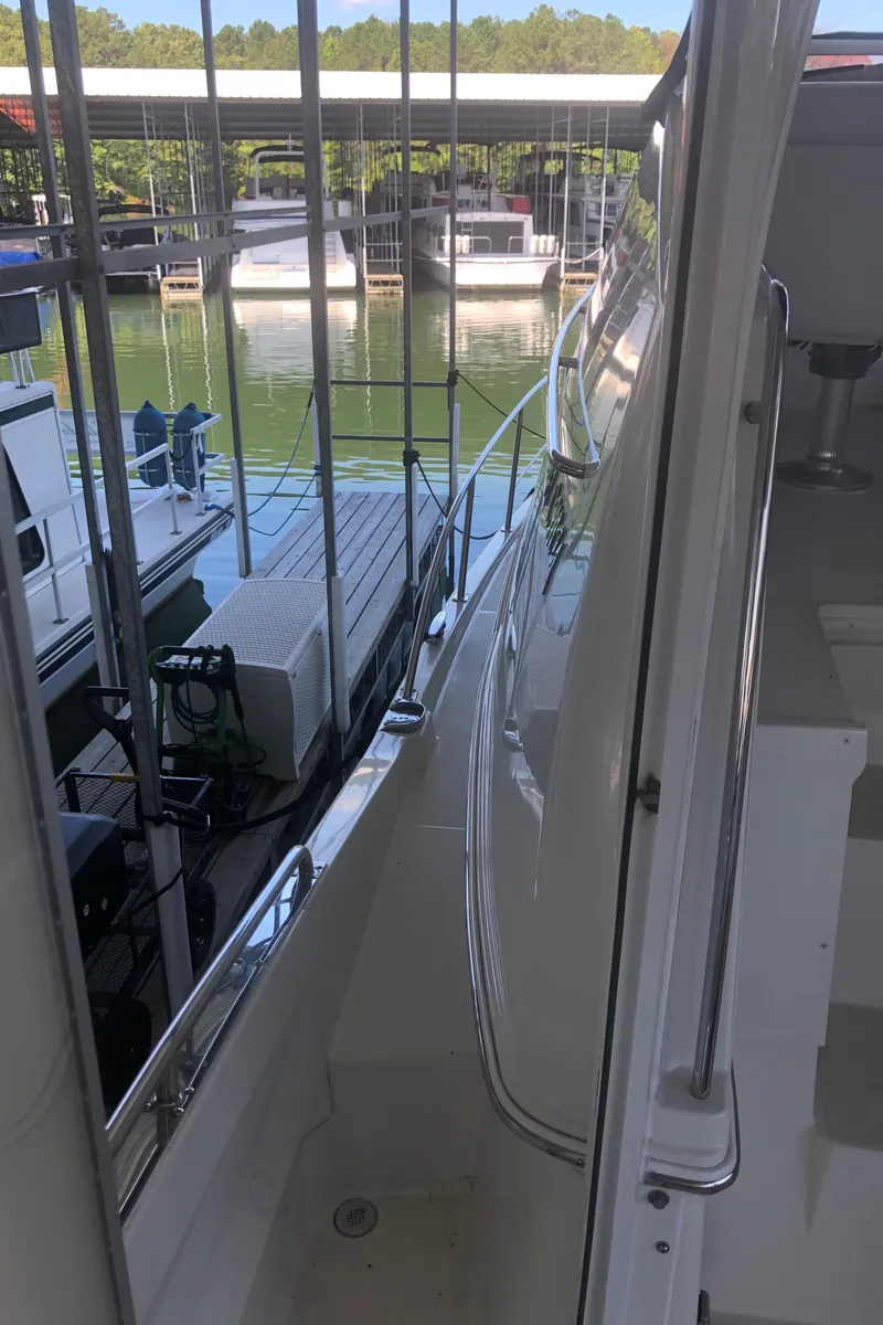 Slide: The Image of 2005 Carver 41 Cockpit Motor Yacht docked at marina. - 18