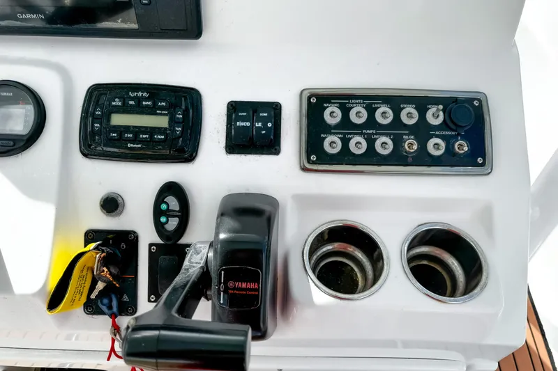 Slide: The Image of Control panel of a 2014 Sportsman Masters 247 Bay Boat with Yamaha throttle. - 12