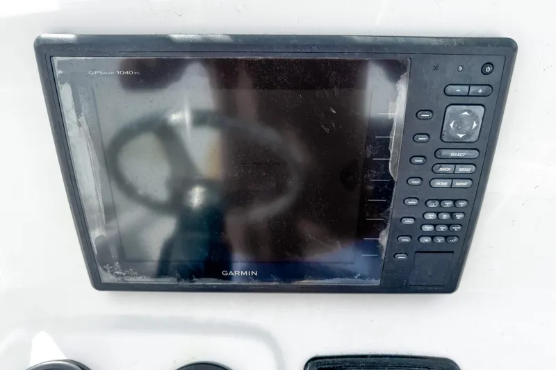 Slide: The Image of Garmin GPSMAP 1040xs on 2014 Sportsman Masters 247 Bay Boat dashboard. - 13