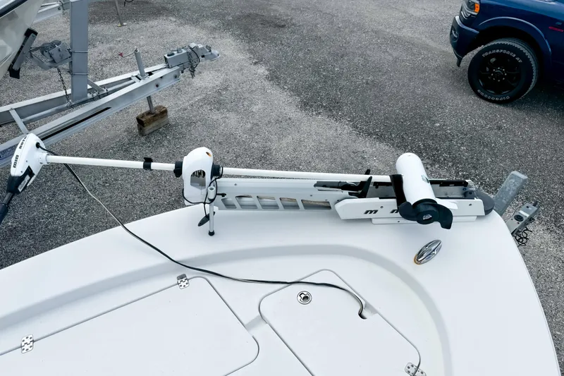 Slide: The Image of 2014 Sportsman Masters 247 Bay Boat with trolling motor on trailer. - 19