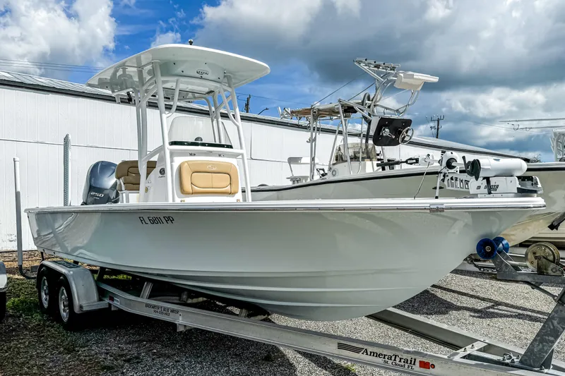Slide: The Image of 2014 Sportsman Masters 247 Bay Boat on trailer under cloudy sky. - 3