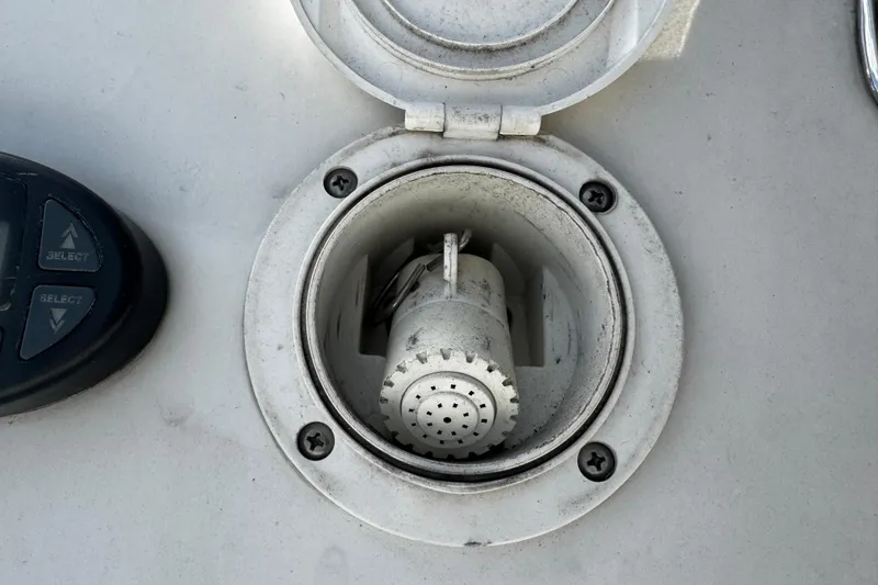 Slide: The Image of 2004 Four Winns 205 Sundowner boat deck detail with control panel and socket. - 11