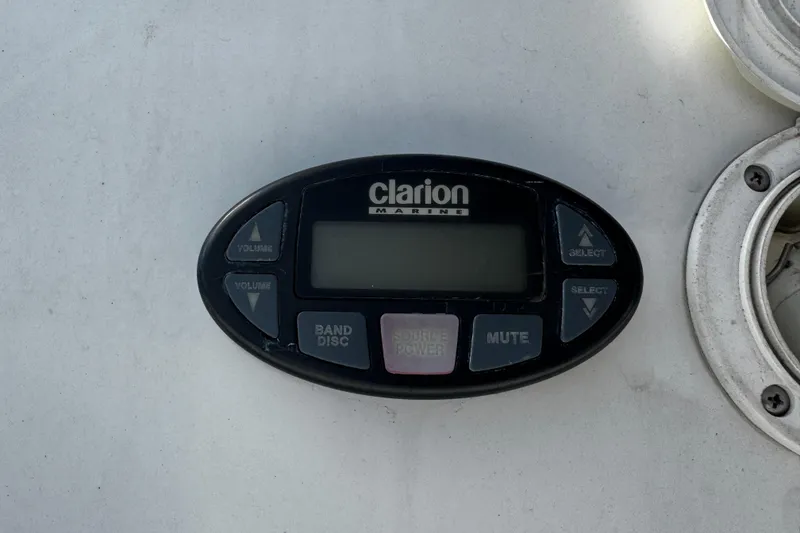 Slide: The Image of Clarion Marine audio control panel on 2004 Four Winns 205 Sundowner boat. - 12
