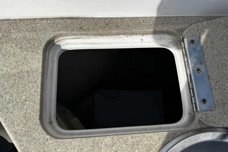 Slide: The Image of Open storage compartment on 2004 Four Winns 205 Sundowner boat. - 15