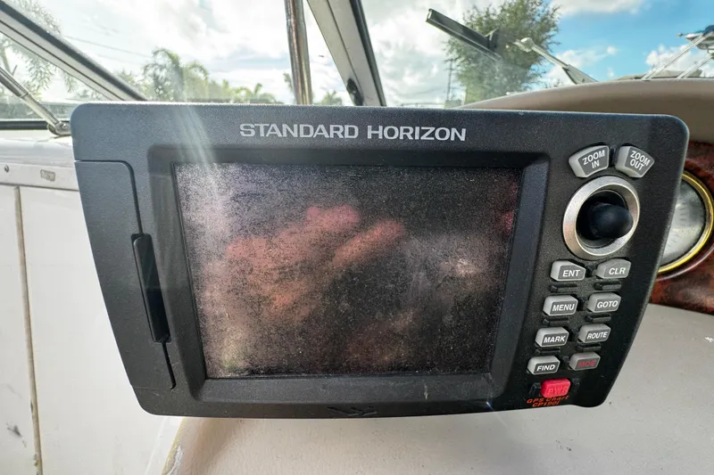 Slide: The Image of Standard Horizon GPS device on 2004 Four Winns 205 Sundowner boat dashboard. - 18