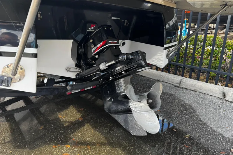 Slide: The Image of 2004 Four Winns 205 Sundowner boat with MerCruiser outdrive and propeller. - 4