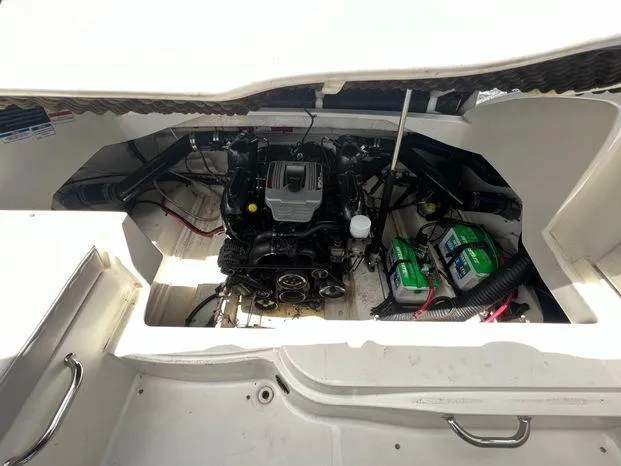 Slide: The Image of Engine compartment of a 2011 Sea Ray 300 Sundeck boat, showing engine and batteries. - 22