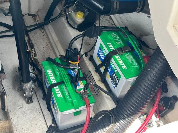 Slide: The Image of Batteries in a 2011 Sea Ray 300 Sundeck boat engine compartment. - 24