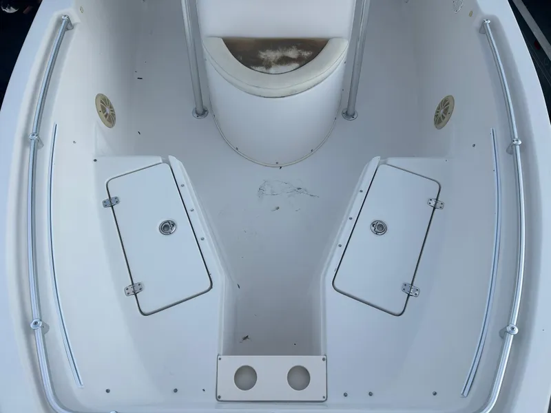 Slide: The Image of 2009 Cobia 216 Center Console boat interior with storage compartments. - 11