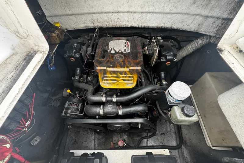 Slide: The Image of Engine compartment of a 2008 Splendor 240 Sunstar boat, showing detailed components. - 11