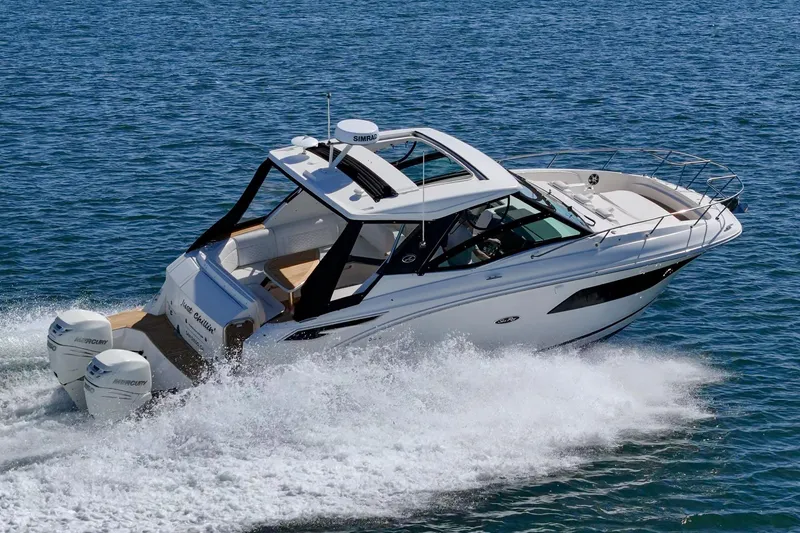 Slide: The Image of 2021 Sea Ray Sundancer 320 Outboard cruising on open water. - 16
