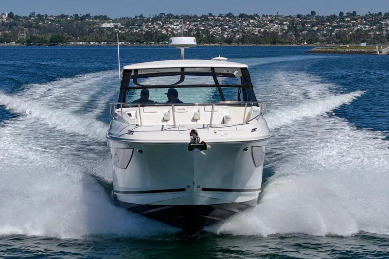 Slide: The Image of 2021 Sea Ray Sundancer 320 Outboard cruising on a scenic waterway. - 17