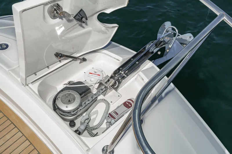 Slide: The Image of 2021 Sea Ray Sundancer 320 Outboard anchor system with open hatch, docked on water. - 22