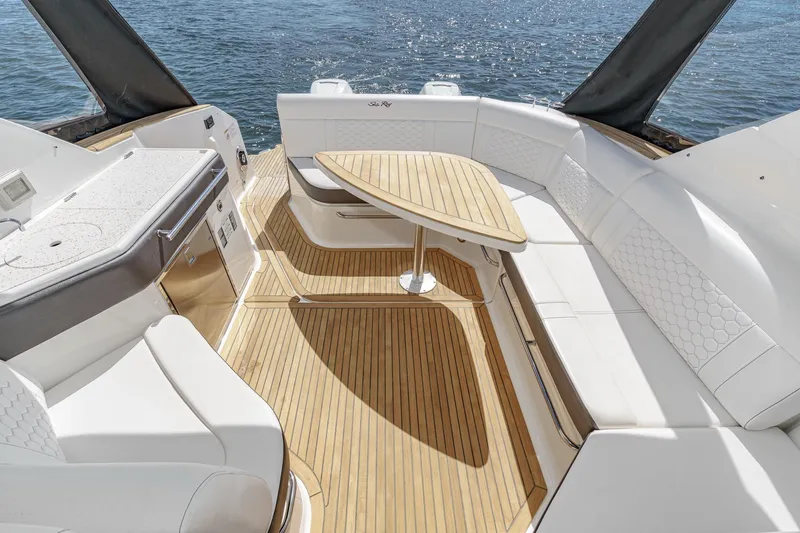 Slide: The Image of Luxurious 2021 Sea Ray Sundancer 320 Outboard interior with elegant seating and wooden flooring. - 25