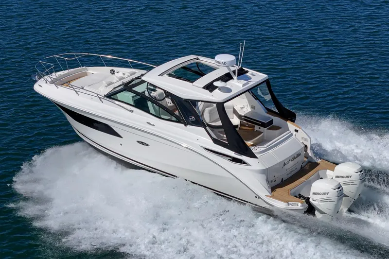 Slide: The Image of 2021 Sea Ray Sundancer 320 Outboard cruising on open water. - 3