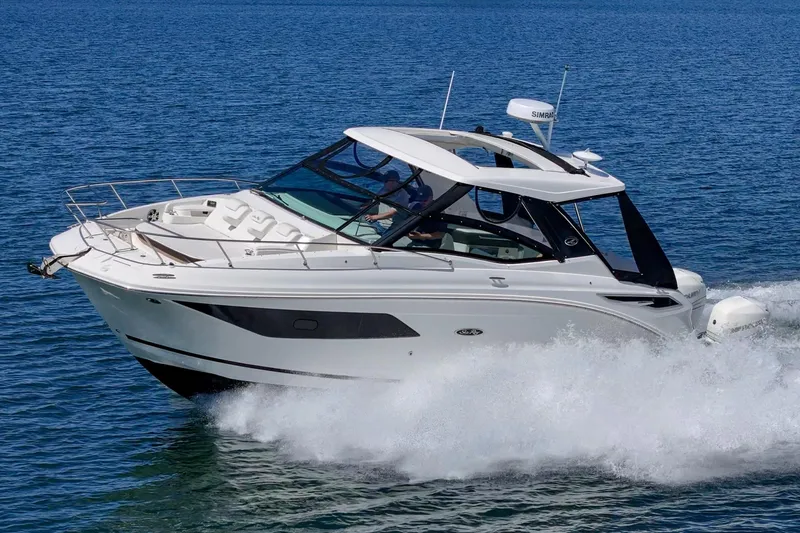Slide: The Image of 2021 Sea Ray Sundancer 320 Outboard cruising on open water. - 4