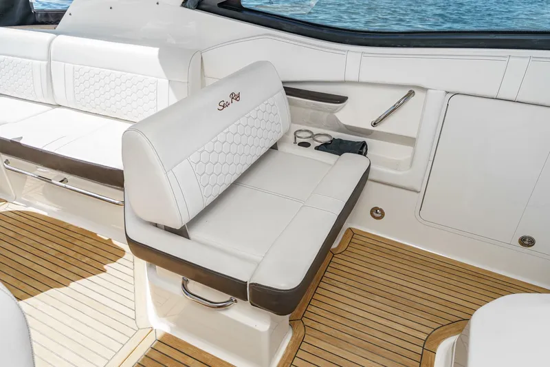 Slide: The Image of Luxurious seating on 2021 Sea Ray Sundancer 320 Outboard with elegant white upholstery. - 43