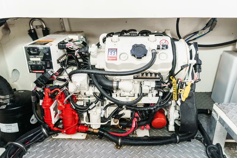 Slide: The Image of Engine compartment of 2021 Sea Ray Sundancer 320 Outboard, showcasing detailed wiring and components. - 55