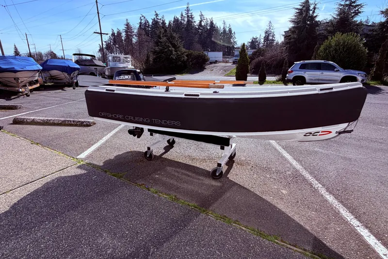 Slide: The Image of OC Tenders OC-300 boat on trailer in parking lot, 2020 model. - 13
