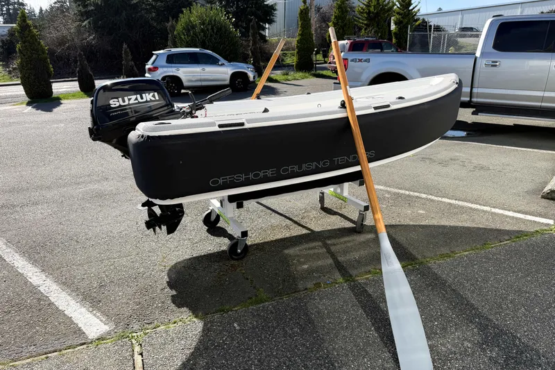 Slide: The Image of 2020 OC Tenders OC-300 boat with Suzuki motor in parking lot. - 20
