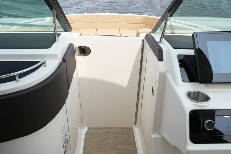 Slide: The Image of 2023 Sea Ray SLX 310 boat interior with modern dashboard and seating. - 10