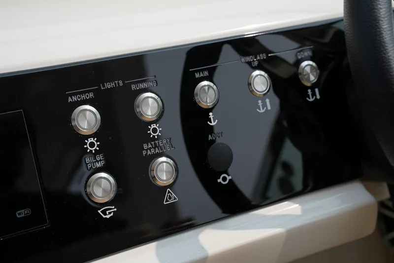 Slide: The Image of Control panel of 2023 Sea Ray SLX 310 boat with various function buttons. - 14