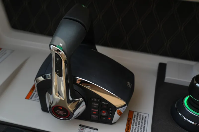 Slide: The Image of Throttle control of 2023 Sea Ray SLX 310 boat, featuring sleek design and advanced controls. - 17