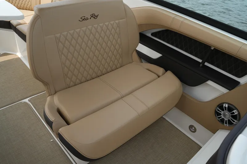 Slide: The Image of Luxurious seating on 2023 Sea Ray SLX 310 boat with beige upholstery and diamond stitching. - 21