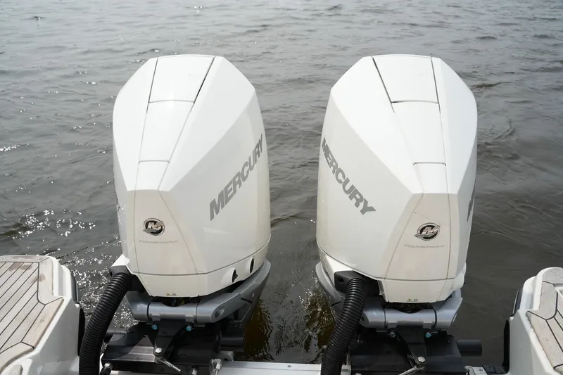 Slide: The Image of Twin Mercury outboard engines on a 2023 Sea Ray SLX 310 boat. - 38