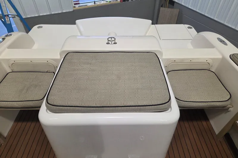 Slide: The Image of 2010 Westport 23 Bow Rider Tender with cushioned seating and sleek design. - 10