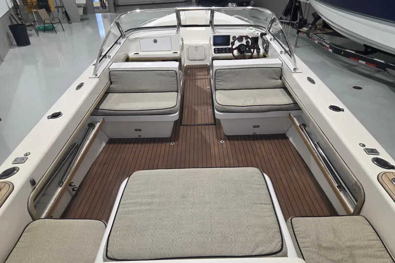 Slide: The Image of 2010 Westport 23 Bow Rider Tender with spacious seating and elegant wood flooring. - 12