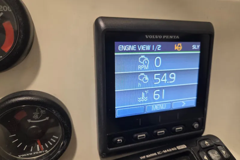 Slide: The Image of Volvo Penta engine display on 2010 Westport 23 bow rider tender, showing RPM and temperature. - 14