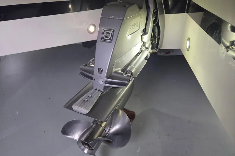 Slide: The Image of Close-up of a 2010 Westport 23 Bow Rider Tender's propeller and stern drive. - 22