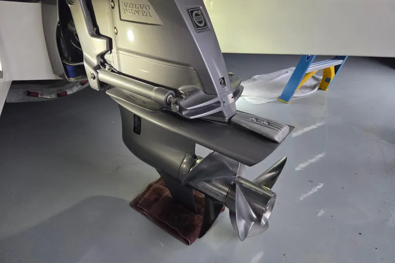 Slide: The Image of Volvo Penta outboard motor on 2010 Westport 23 bow rider tender in a garage. - 23