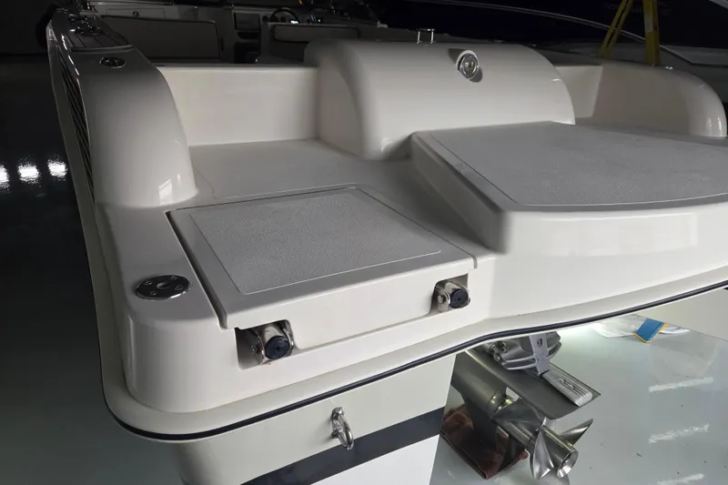 Slide: The Image of 2010 Westport 23 Bow Rider Tender, rear view with sleek design and propeller detail. - 24