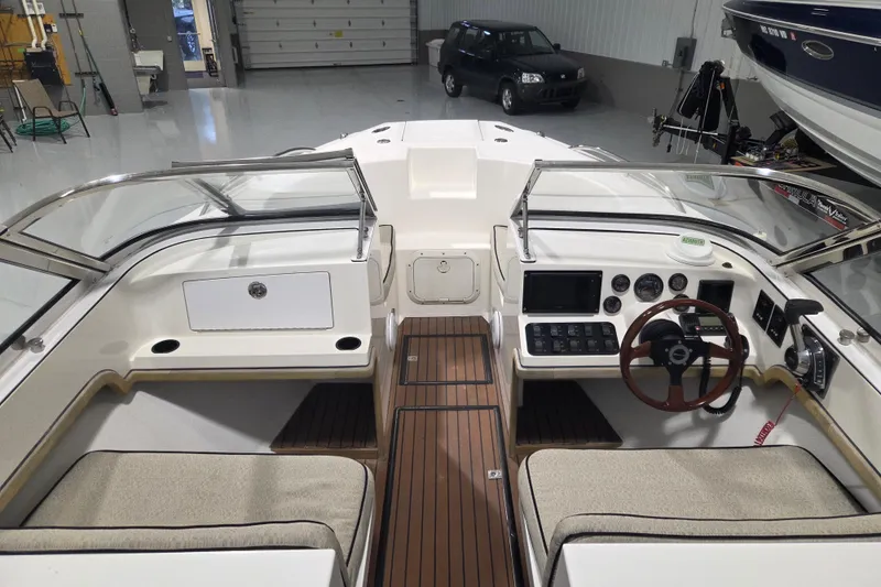 Slide: The Image of Interior view of a 2010 Westport 23 Bow Rider Tender, showcasing helm and seating area. - 3