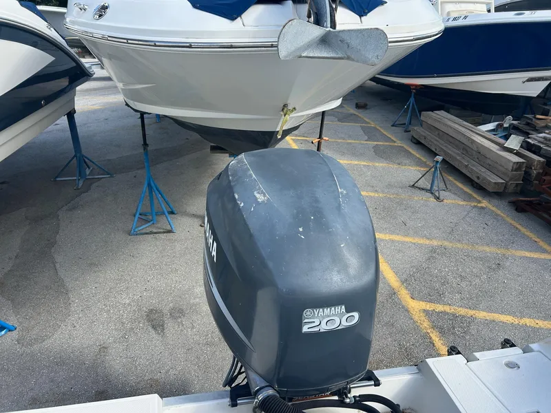 Slide: The Image of 1998 Cobia 224 CC boat with Yamaha 200 outboard motor on dry dock. - 18