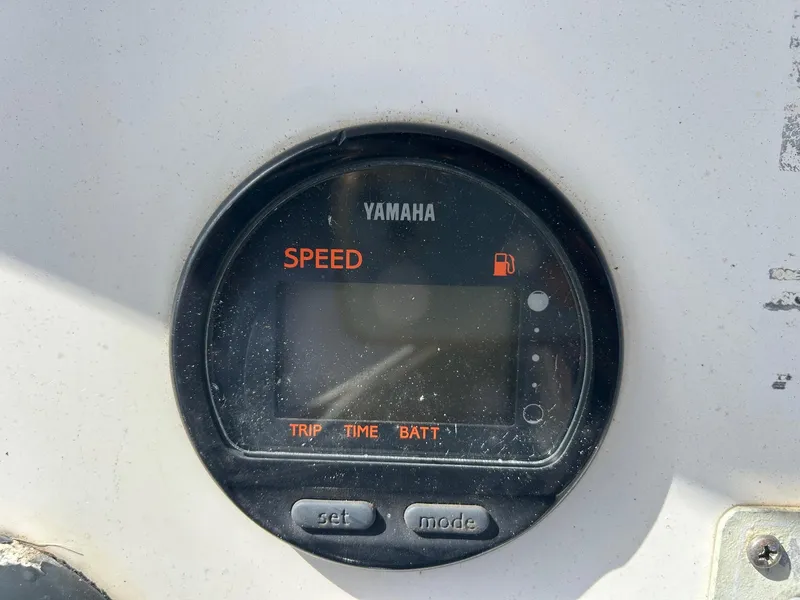 Slide: The Image of Yamaha speedometer on 1998 Cobia 224 CC boat dashboard, showing speed, trip, and battery indicators. - 8