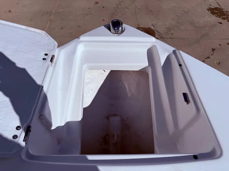 Slide: The Image of Open storage compartment of a 2023 Monterey 224FS boat. - 11