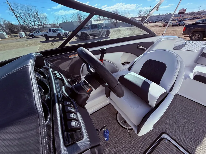 Slide: The Image of Interior of a 2023 Monterey 224FS boat with steering console. - 14