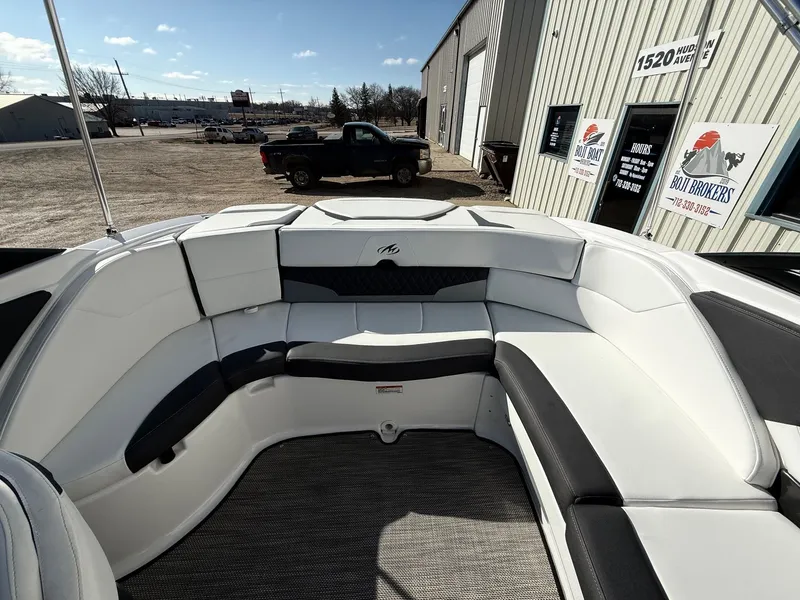 Slide: The Image of Interior of a 2023 Monterey 224FS boat with white and black upholstery. - 22