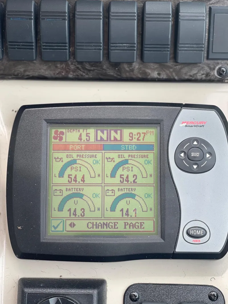 Slide: The Image of 2007 Sea Ray 380 Sundancer dashboard display showing engine metrics. - 13