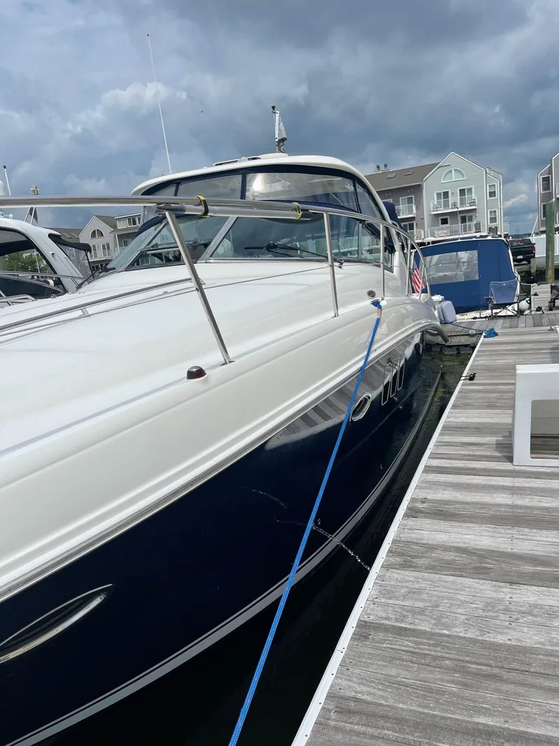 Slide: The Image of 2007 Sea Ray 380 Sundancer docked under cloudy skies. - 2