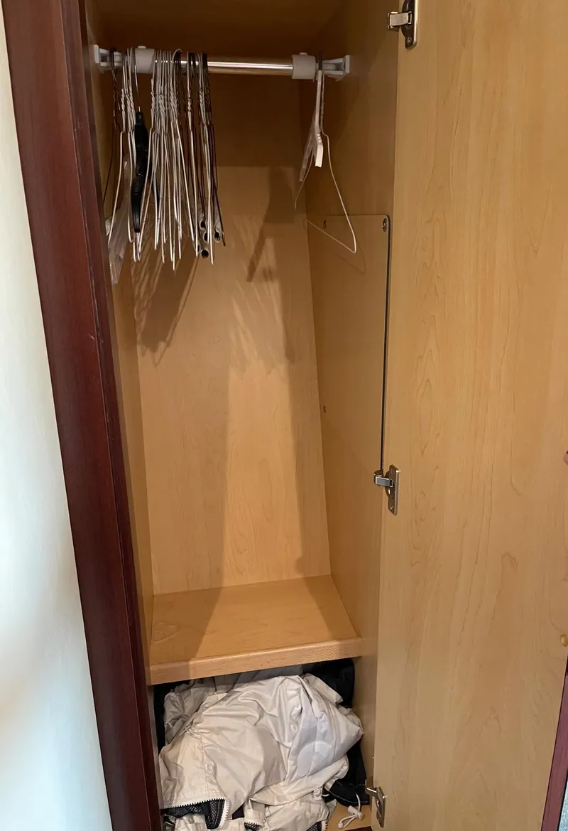 Slide: The Image of Empty closet with hangers on a 2007 Sea Ray 380 Sundancer. - 20