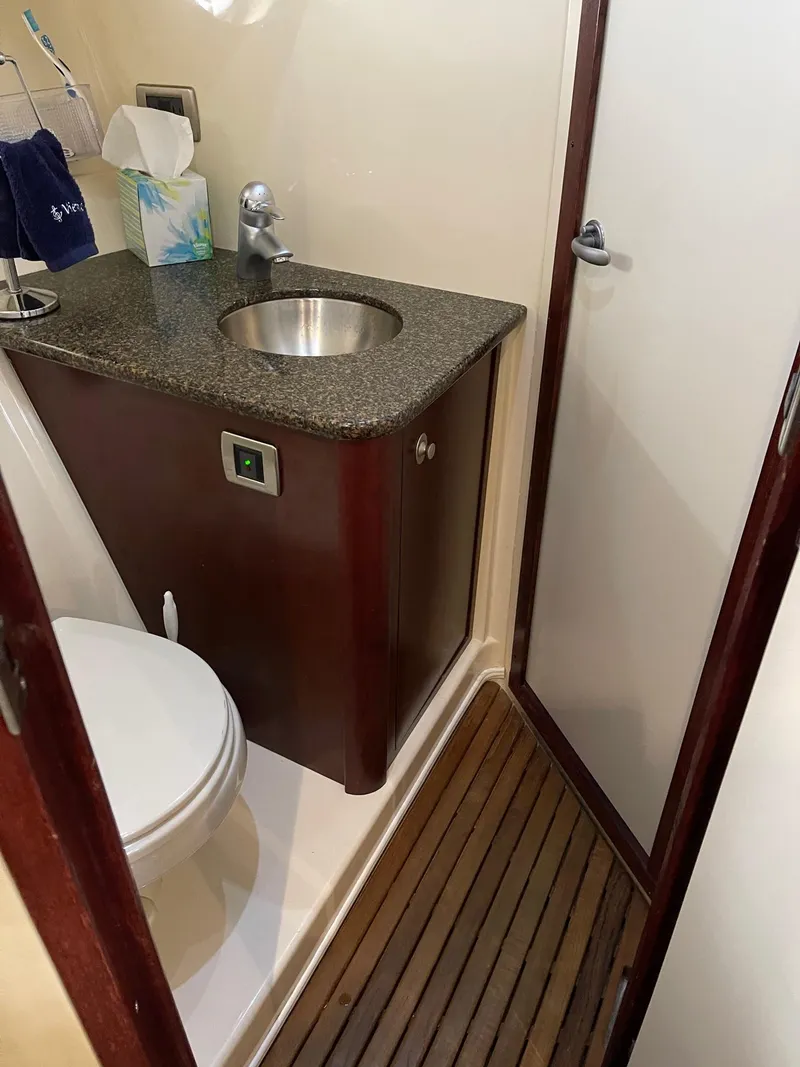 Slide: The Image of Interior of 2007 Sea Ray 380 Sundancer with sink and toilet. - 28